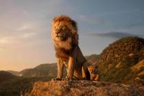 This image released by Disney shows characters, from left, Mufasa, voiced by James Earl Jones, ...