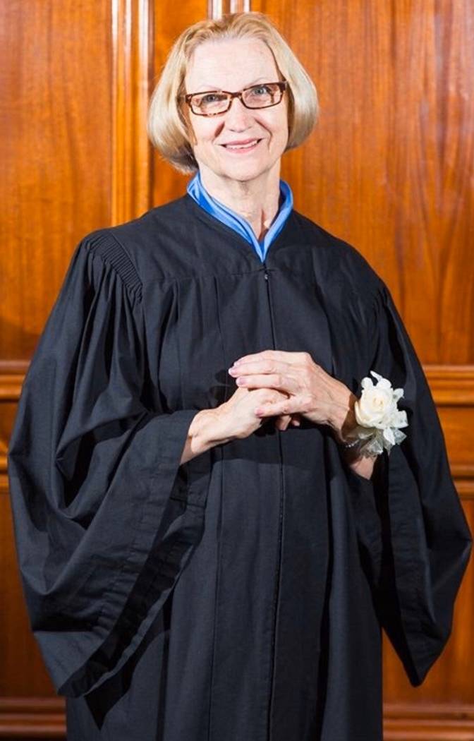 Rev. Kathryn Murphy poses in black ministerial robes in May 2016. Murphy, who worked as a chapl ...
