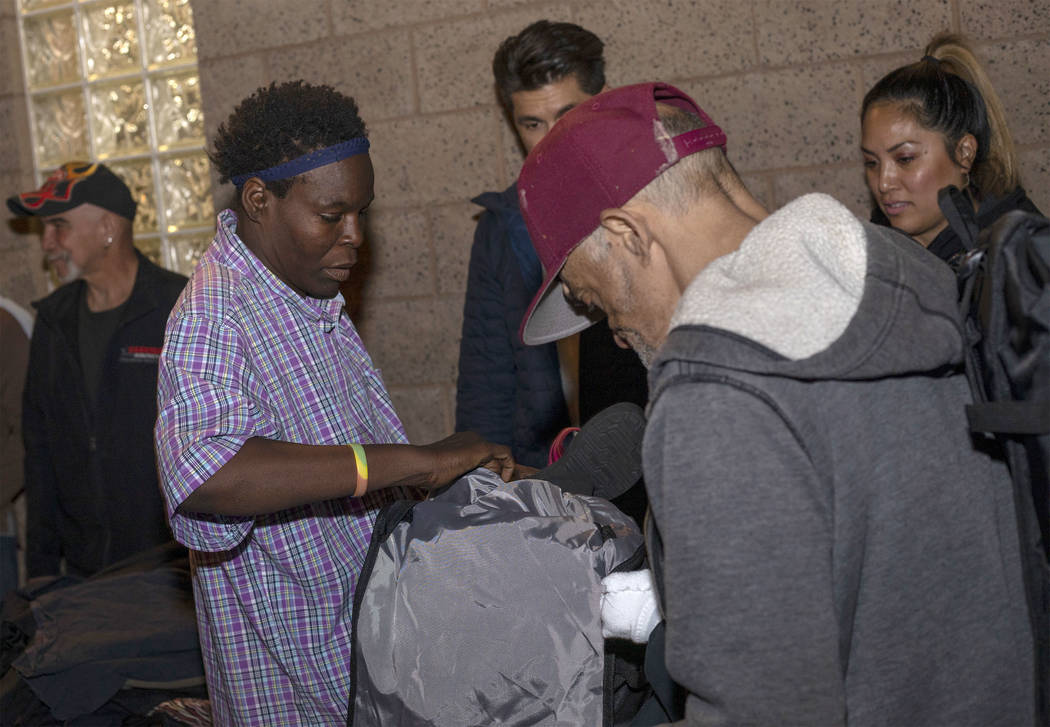 Linda Evans fills her new CITYPAK with donated clothing at the Las Vegas Rescue Mission on Satu ...