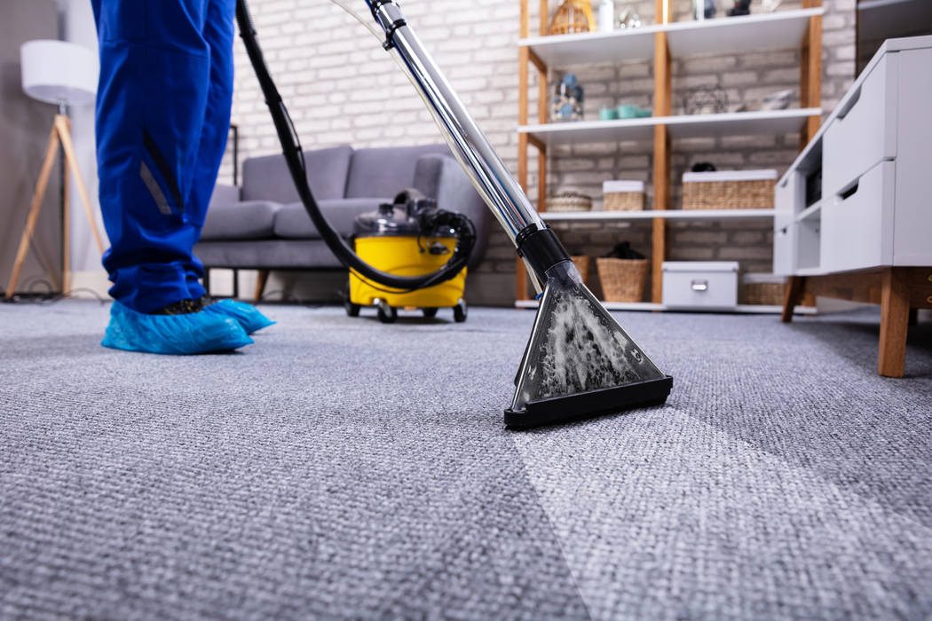 Getty Images Hire a steam cleaning service to handle carpet traffic areas.