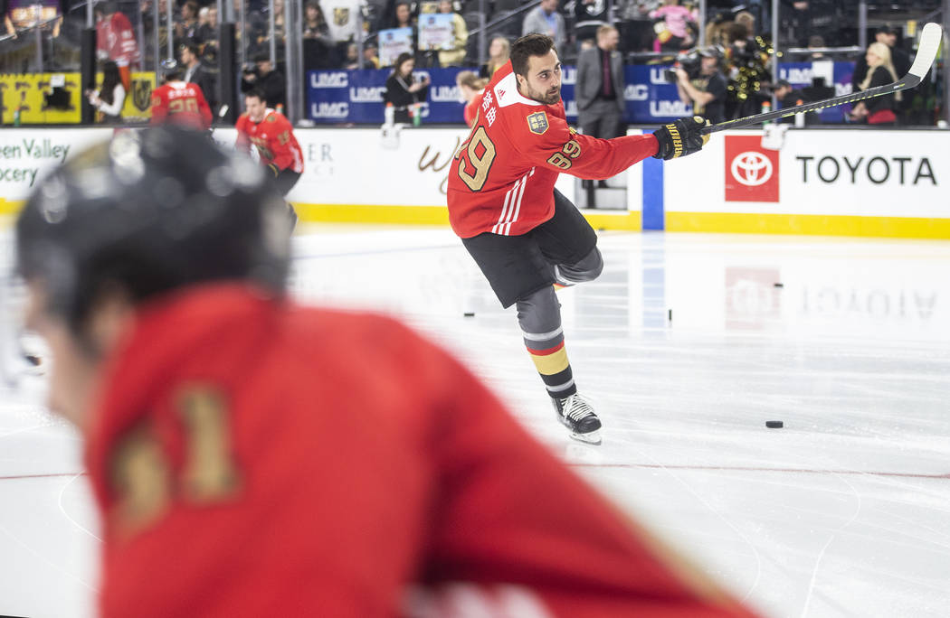 Vegas Golden Knights right wing Alex Tuch (89) wears a jersey commemorating Chinese New Year du ...