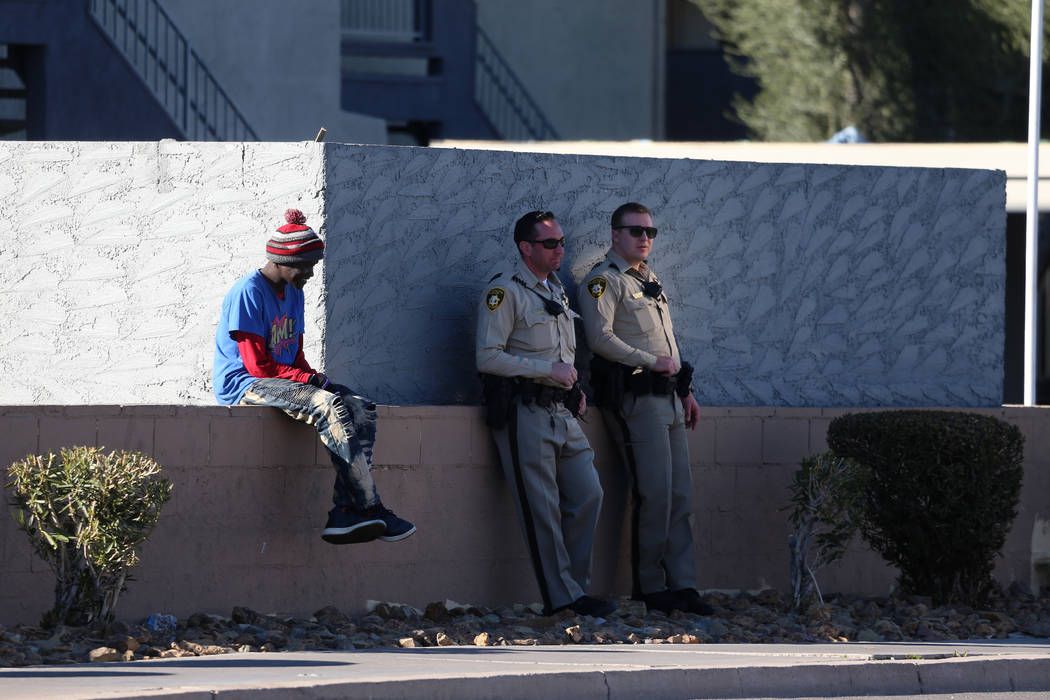 Police investigate a homicide at the intersection near Swenson Street and Twain Avenue in Las V ...