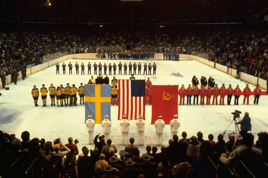 In this Feb. 24, 1980 file photo, U.S., Swedish, and Soviet teams line up to receive their Olym ...