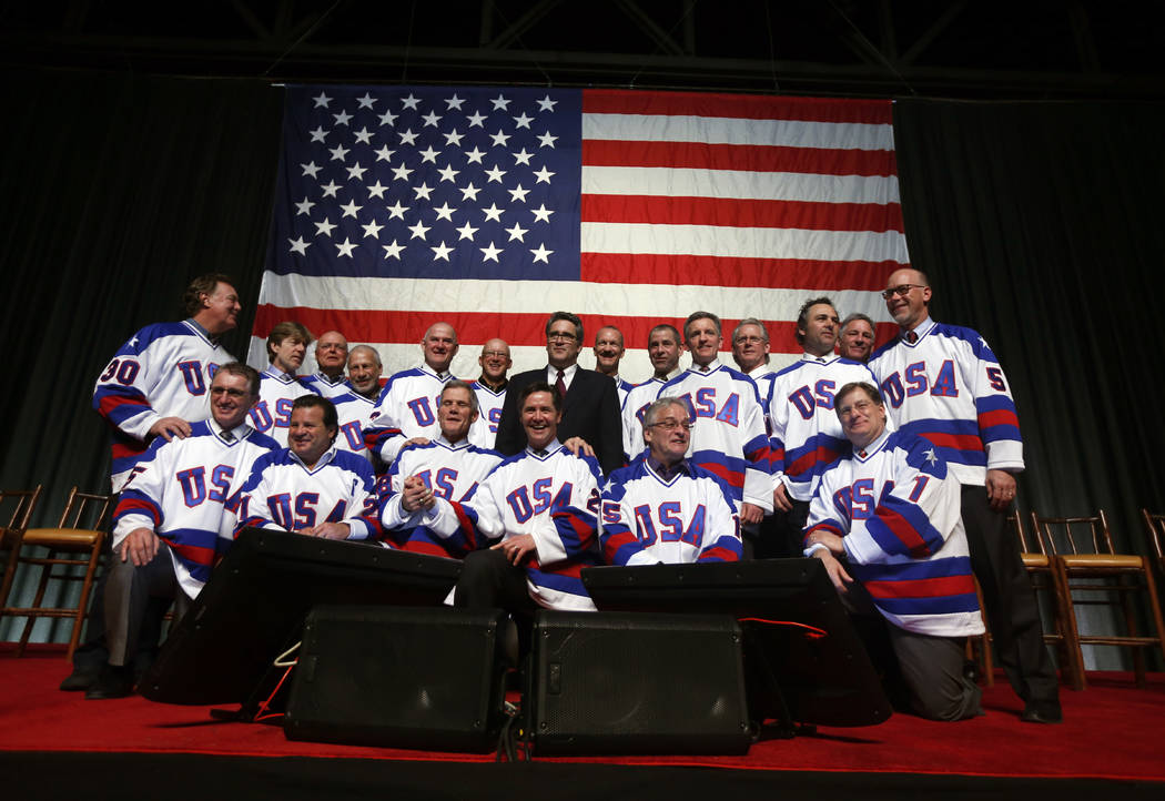 Members of the 1980 U.S. ice hockey team pose for photos after a "Relive the Miracle" reunion a ...