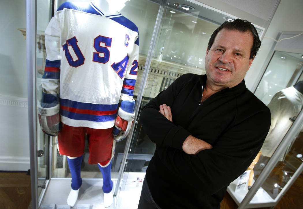 Mike Eruzione, captain of the 1980 gold medal winning U.S. Olympic ice hockey team poses next t ...
