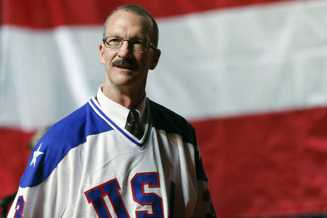 Ken Morrow of the 1980 U.S. ice hockey team walks on stage during a "Relive the Miracle&qu ...
