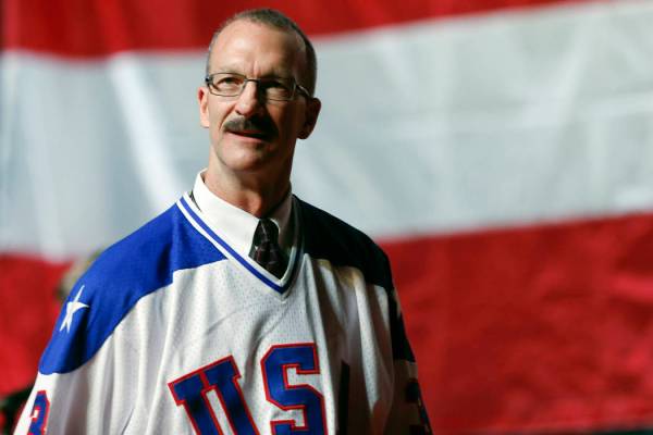 Ken Morrow of the 1980 U.S. ice hockey team walks on stage during a "Relive the Miracle&qu ...