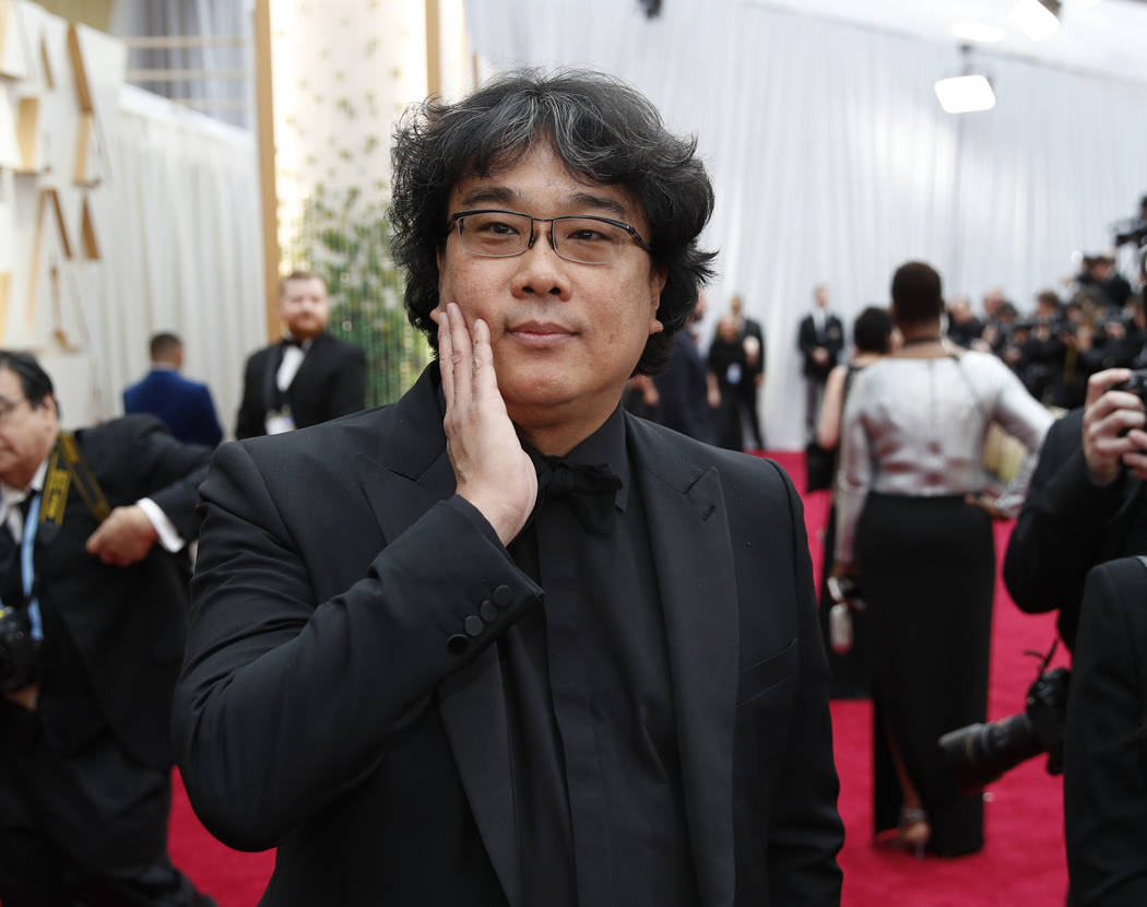 Bong Joon-ho arrives at the Oscars on Sunday, Feb. 9, 2020, at the Dolby Theatre in Los Angeles ...