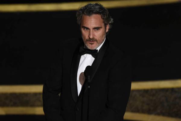 Joaquin Phoenix accepts the award for best performance by an actor in a leading role for " ...