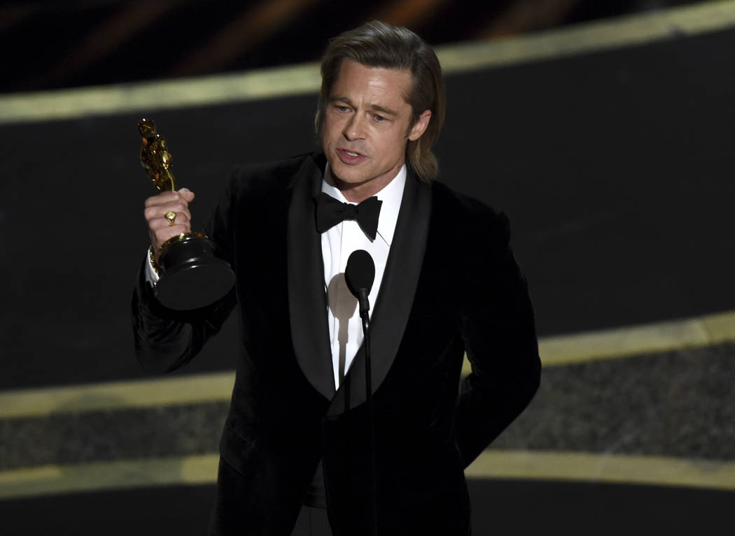 Brad Pitt accepts the award for best performance by an actor in a supporting role for "Onc ...