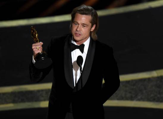 Brad Pitt accepts the award for best performance by an actor in a supporting role for "Onc ...