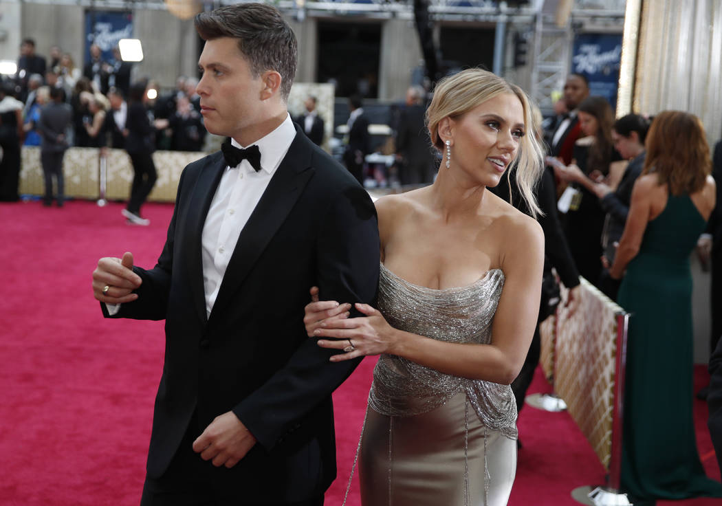 Colin Jost, left, and Scarlett Johansson arrive at the Oscars on Sunday, Feb. 9, 2020, at the D ...