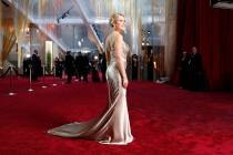 Scarlett Johansson arrives at the Oscars on Sunday, Feb. 9, 2020, at the Dolby Theatre in Los A ...