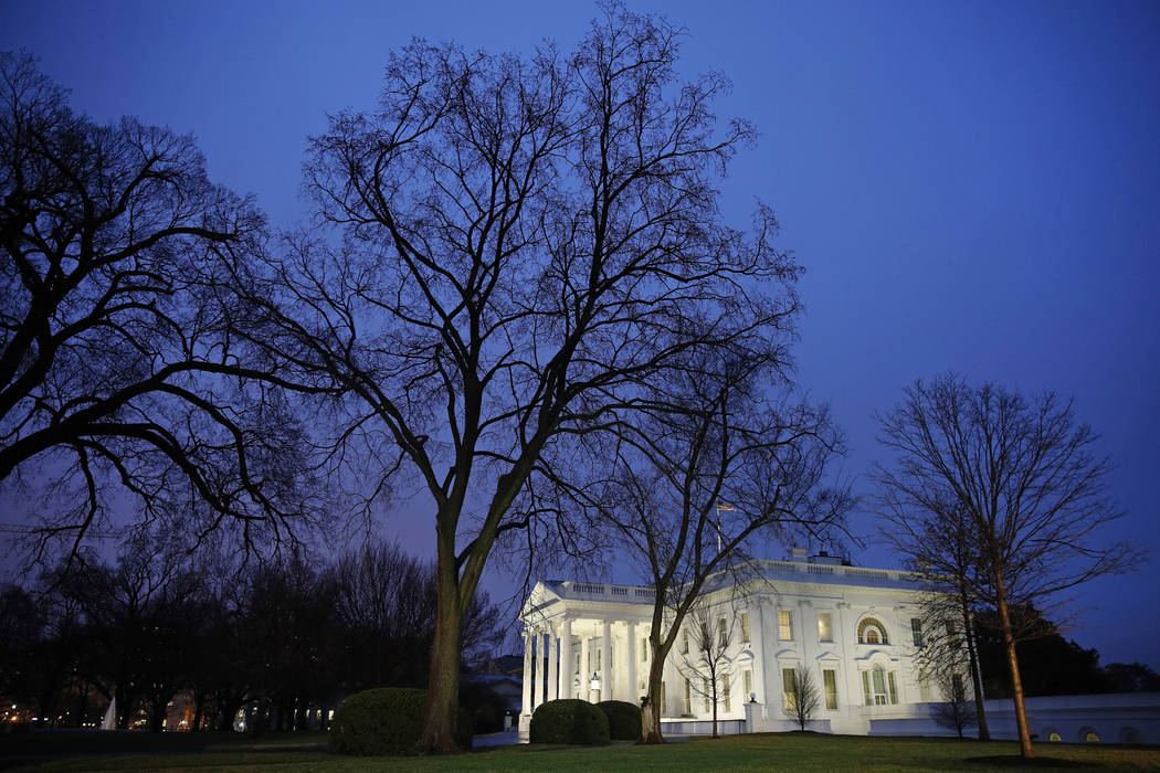 In this Feb. 6, 2020 photo, dusk settles over the White House in Washington. Confronted with tr ...