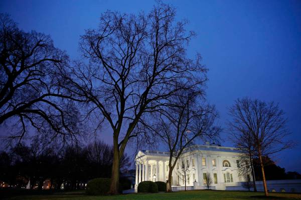 In this Feb. 6, 2020 photo, dusk settles over the White House in Washington. Confronted with tr ...