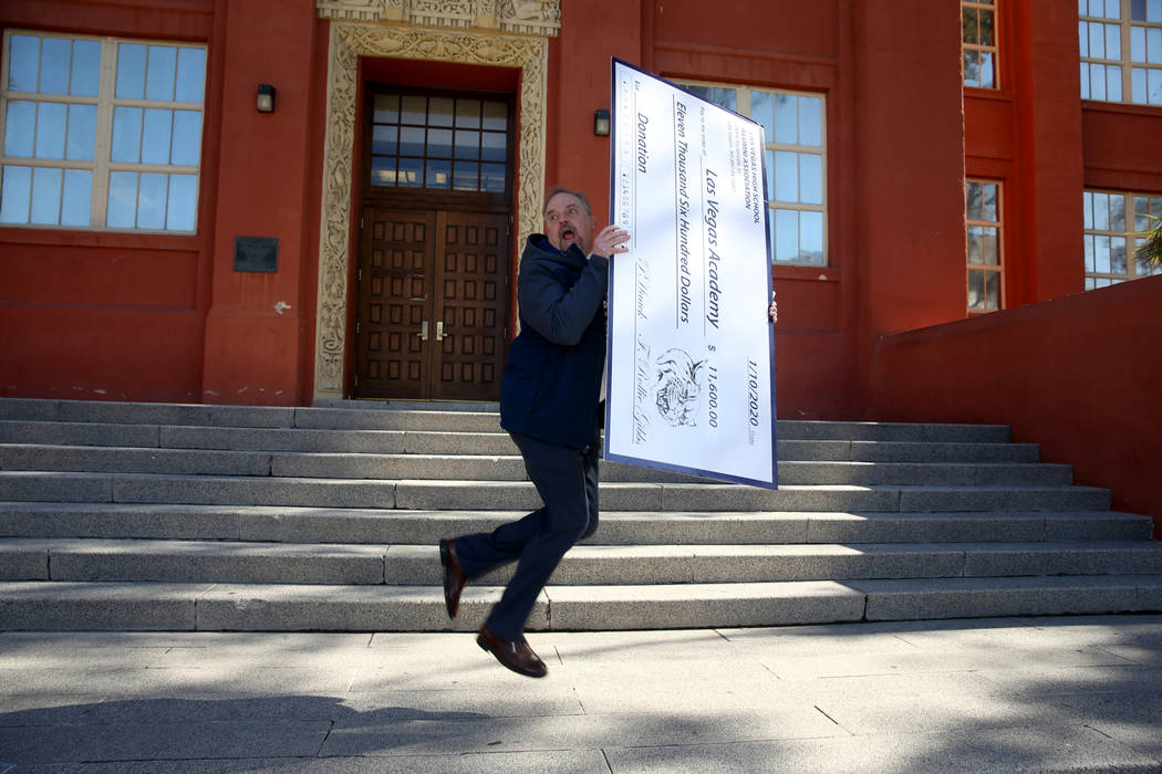 Las Vegas Academy principal Scott Walker celebrates with an oversized check from the Las Vegas ...