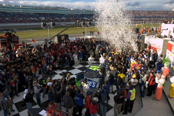 Jimmie Johnson celebrates in victory lane after winning the NASCAR Nextel Cup UAW-DaimlerChrysl ...