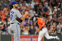 FILE - In this Aug. 4, 2017 file photo Toronto Blue Jays relief pitcher Mike Bolsinger, left, w ...