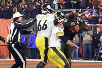 FILE - In this Nov. 14, 2019, file photo, Cleveland Browns defensive end Myles Garrett (95) hit ...