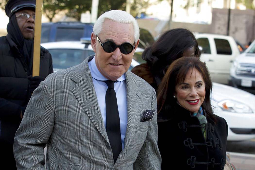 Roger Stone accompanied by his wife Nydia Stone, right, arrives at federal court in Washington, ...