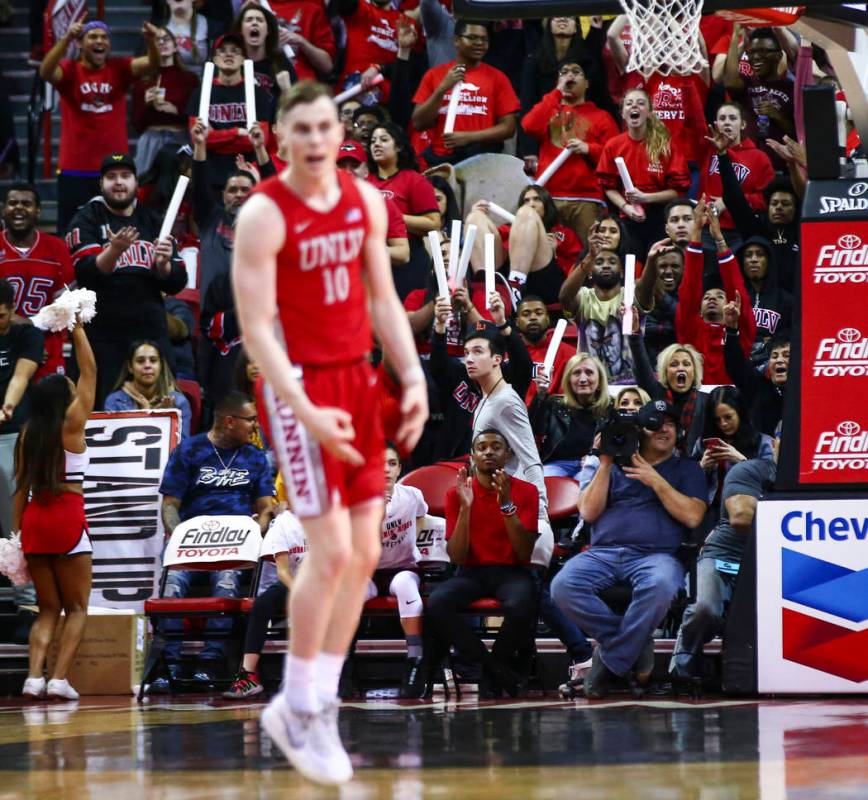 UNLV's Jonah Antonio (10) celebrates his three-pointer against UNR during the first half of a b ...