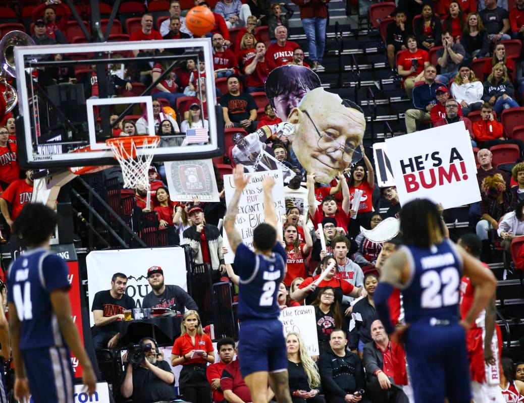 UNLV fans try to distract UNR's Jalen Harris (2) as he attempts a free throw during the second ...