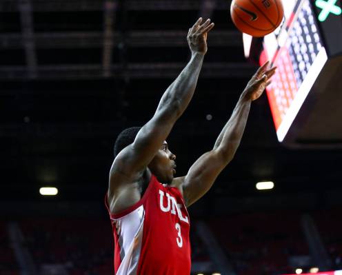 UNLV's Amauri Hardy (3) shoots to even the score against UNR during overtime in a basketball ga ...
