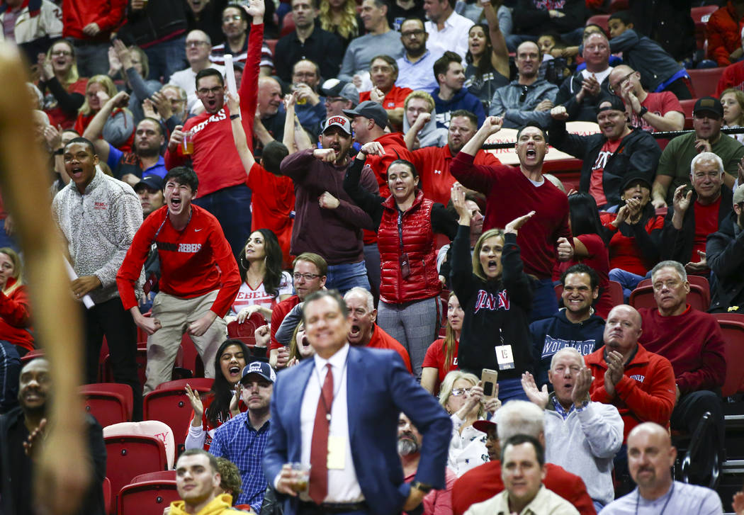 UNLV fans celebrate during the second half of a basketball game against UNR at the Thomas & ...