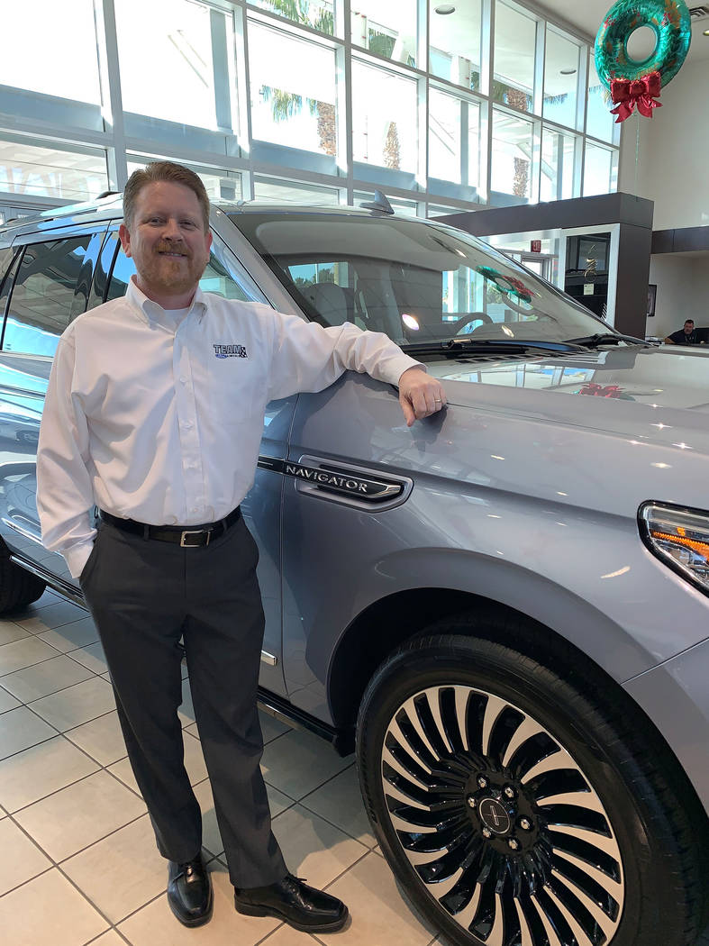Bill Jenkins, Lincoln brand manager at Team Ford Lincoln, stands in the showroom of the dealers ...