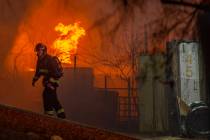 North Las Vegas Fire and Las Vegas Fire departments knock down a fire about the Purcell Tire an ...