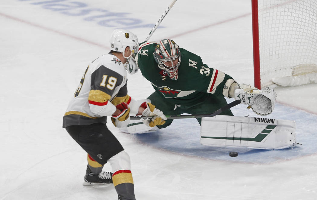 Minnesota Wild's Alex Stalock, right, stops a shot by Vegas Golden Knights' Reilly Smith in the ...