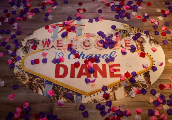 Flower petals are scattered about a logo for the Chapel Diane, one of two within the Chapels at ...