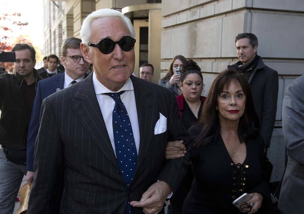 In this Nov. 15, 2019, file photo, Roger Stone, left, with his wife Nydia Stone, leaves federal ...