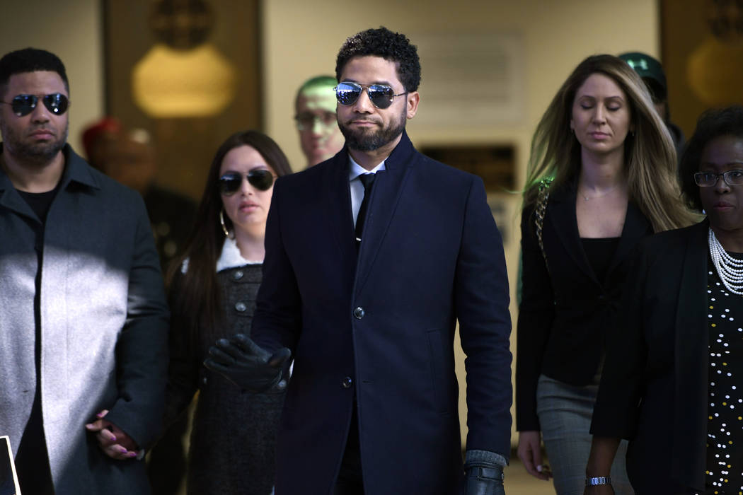 FILE - In this March 26, 2019 file photo, actor Jussie Smollett gestures as he leaves Cook Coun ...