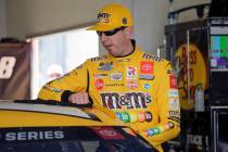 Kyle Busch prepares to get in his car during NASCAR auto race practice at Daytona International ...