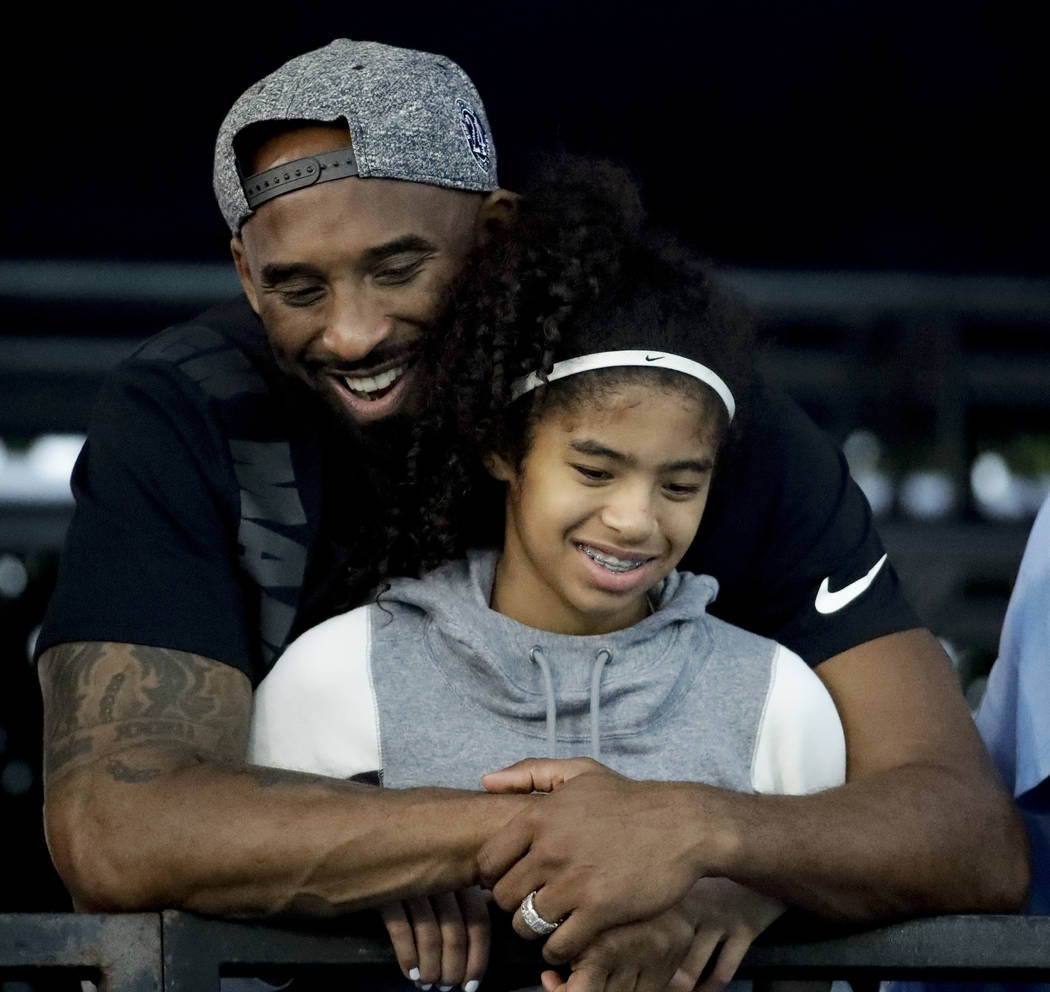 FILE - In this July 26, 2018, file photo former Los Angeles Laker Kobe Bryant and his daughter ...
