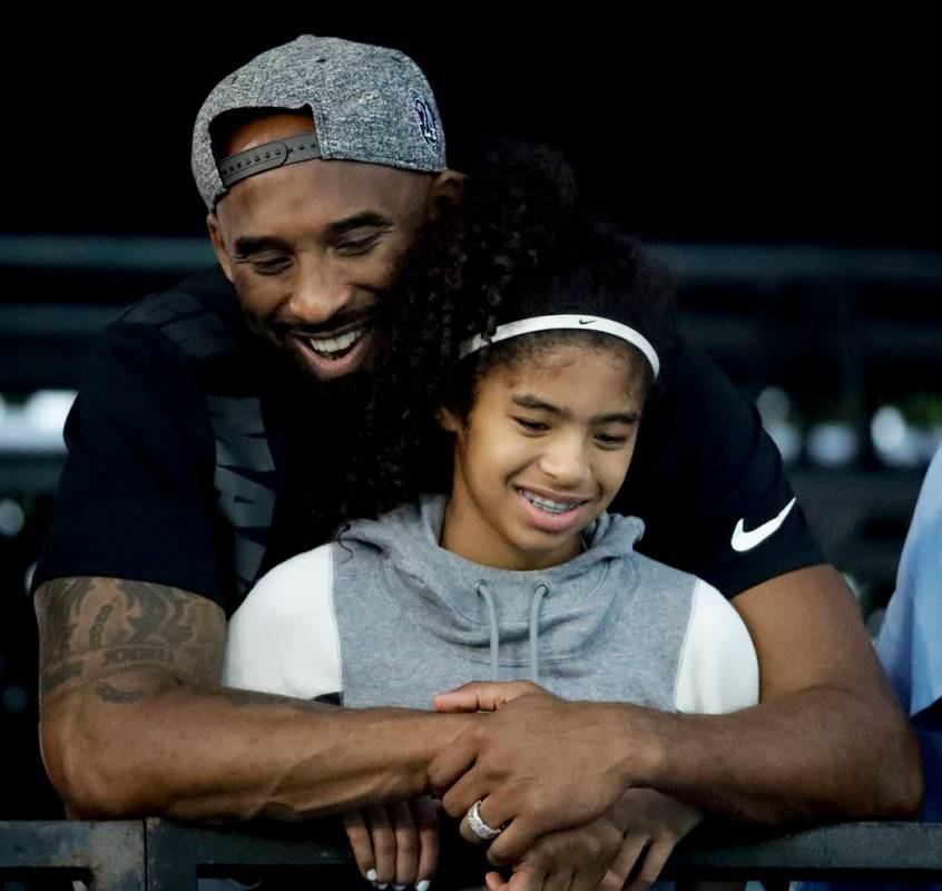 FILE - In this July 26, 2018, file photo former Los Angeles Laker Kobe Bryant and his daughter ...