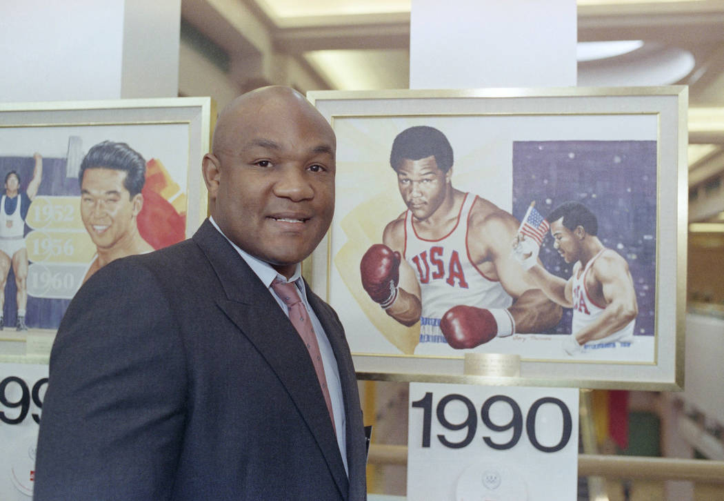 Boxer George Foreman posed by a painting of himself when he was at Olympic in 1988, prior to hi ...