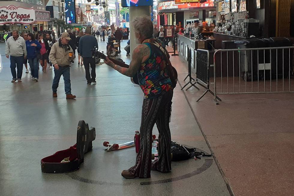 A guitar player performs Wednesday, Feb. 12, 2020, on the Fremont Street Experience in Las Vega ...
