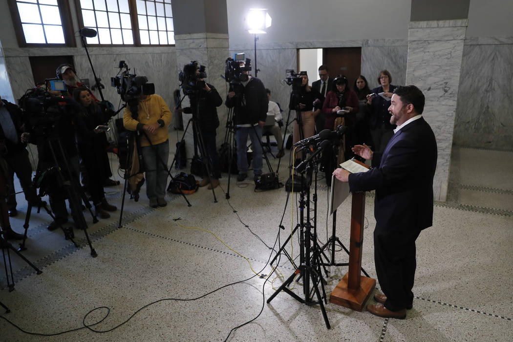 Iowa Democratic Party chairman Troy Price speaks to members of the media during a news conferen ...