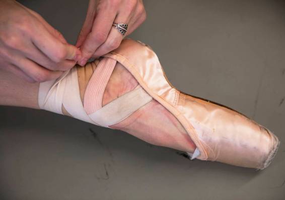 Dancer Betsy Lucas ties her shoes before rehearsal at Nevada Ballet Theatre in Las Vegas, Thurs ...