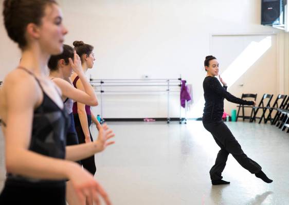 Krista Baker, director and choreographer, far right, directs dancers during a rehearsal for her ...