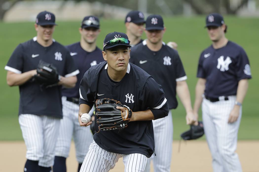 New York Yankees' Masahiro Tanaka, of Japan,during a spring training baseball workout Thursday, ...