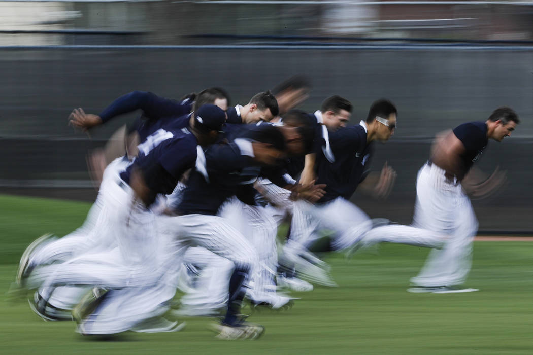 New York Yankees pitchers run during a spring training baseball workout Thursday, Feb. 13, 2020 ...