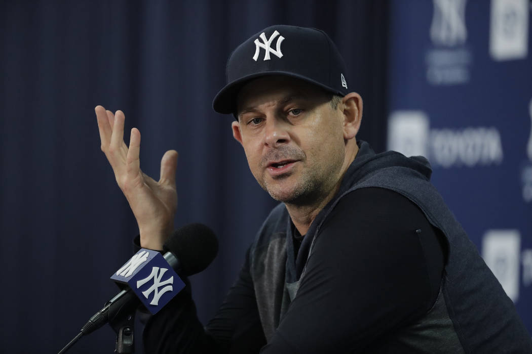 New York Yankees manager Aaron Boone speaks during a news conference after spring training base ...