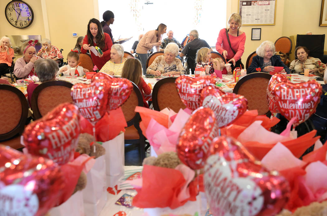 Preschoolers, toddlers and their moms celebrated Valentine's Day with the senior residents at P ...