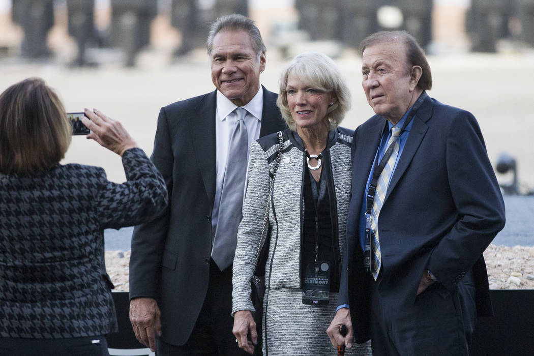 Former Raiders players Jim Plunkett, from left, with his wife Gerry, and Fred Biletnikoff, duri ...