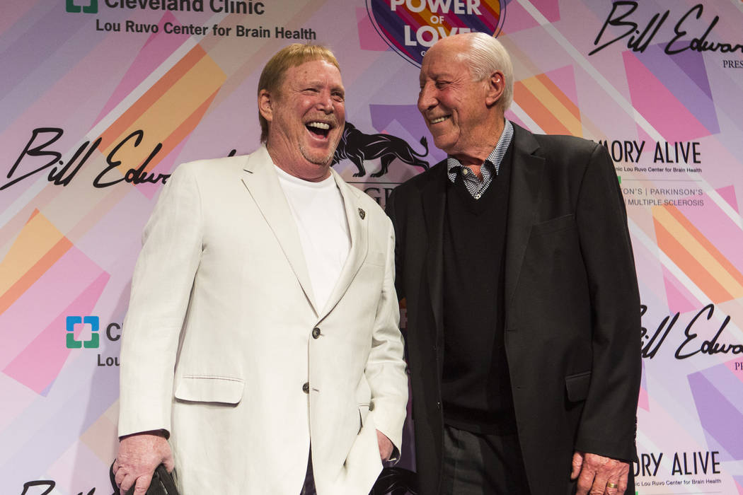 Oakland Raiders owner Mark Davis, left, poses with former Raiders player and coach Fred Biletni ...
