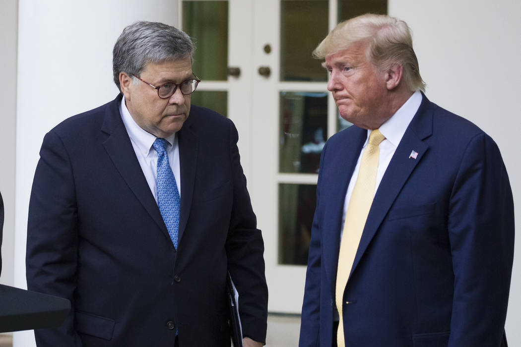 FILE - In this July 11, 2019, file photo, Attorney General William Barr, left, and President Do ...