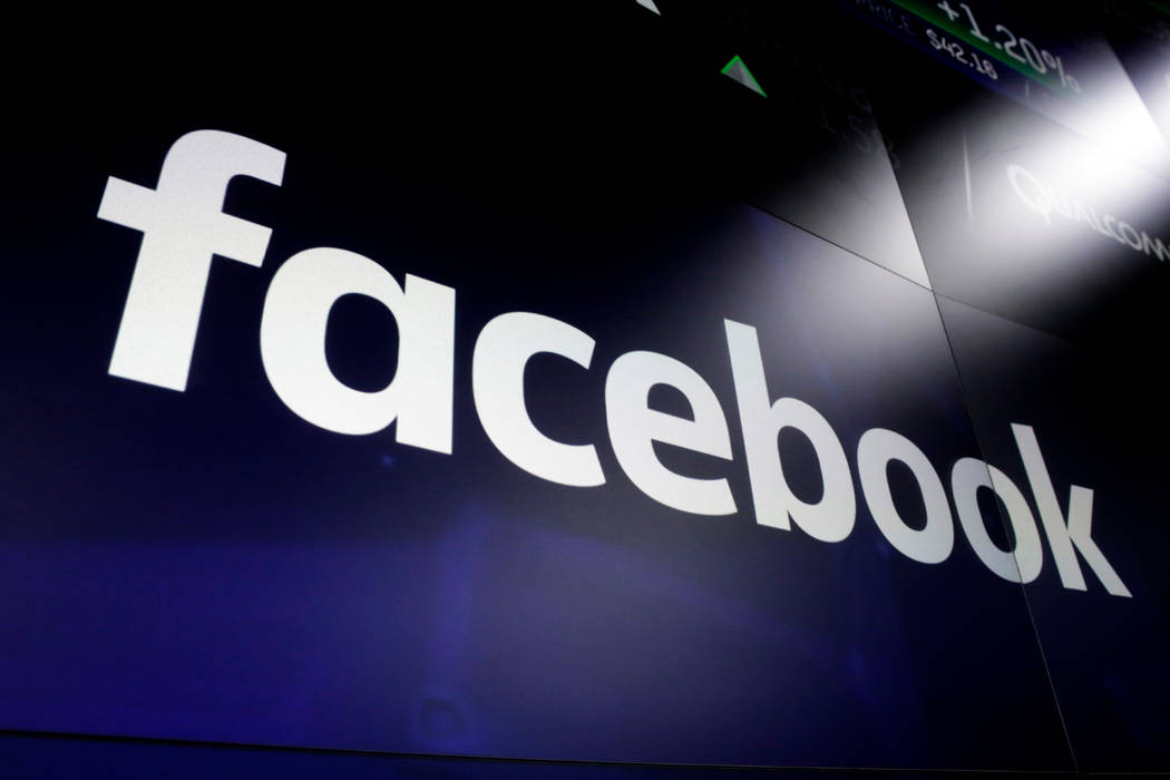 FILE - In this March 29, 2018 file photo shows the logo for Facebook at the Nasdaq MarketSite, ...